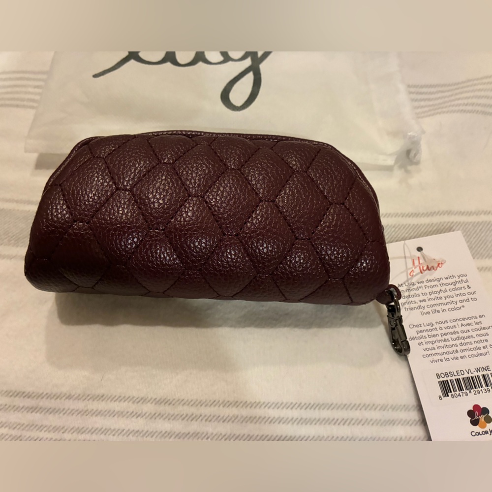 NWT Bobsled Vegan leather in color: wine